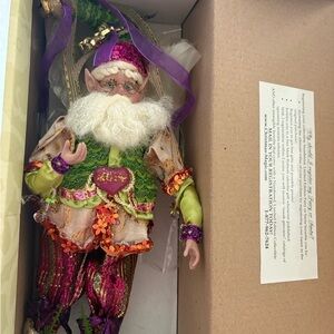 Festive Elf Figurine with Green and Purple Accents